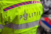 Close-up of a Dutch police officer's high-visibility jacket